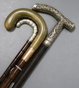 Two silver mounted and handled walking sticks and a horn, 9ct mounted walking stick