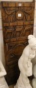 A West African hardwood grain store door carving W.44cm