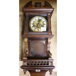 A late Victorian walnut eight day wall clock