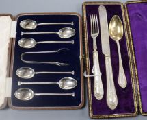 A cased set of six silver teaspoons and pair of tongs and a cased christening trio.