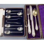 A cased set of six silver teaspoons and pair of tongs and a cased christening trio.