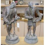 A pair of bronzed metal figures of musicians height 52cm