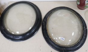 A pair of convex glazed frames length 57cm