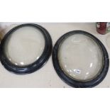 A pair of convex glazed frames length 57cm