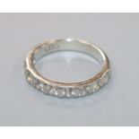 A palladium and nine stone diamond half eternity ring, size M.