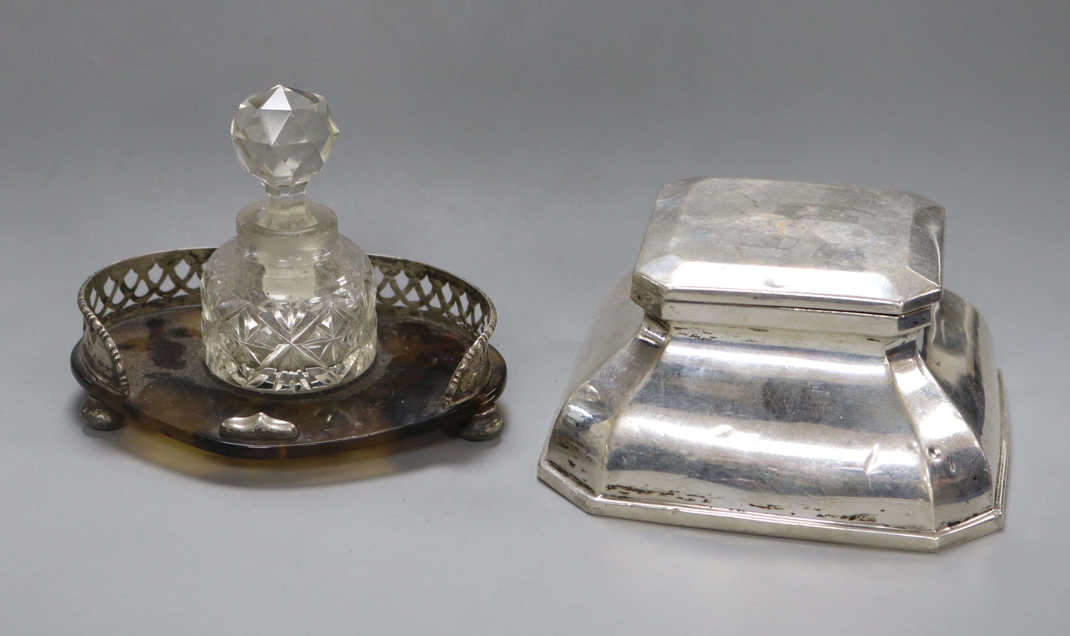 A silver mounted inkwell and a silver mounted inkstand with glass bottle and stopper.