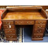 An early 20th century George III style mahogany roll top desk W.122cm