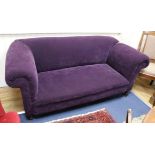 A late Victorian drop-arm Chesterfield settee upholstered in purple fabric W.190cm