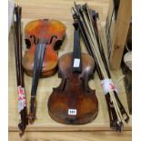 Two Saxon violins and approx. 25 assorted bows