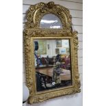 An 18th century giltwood and gesso wall mirror H.100cm