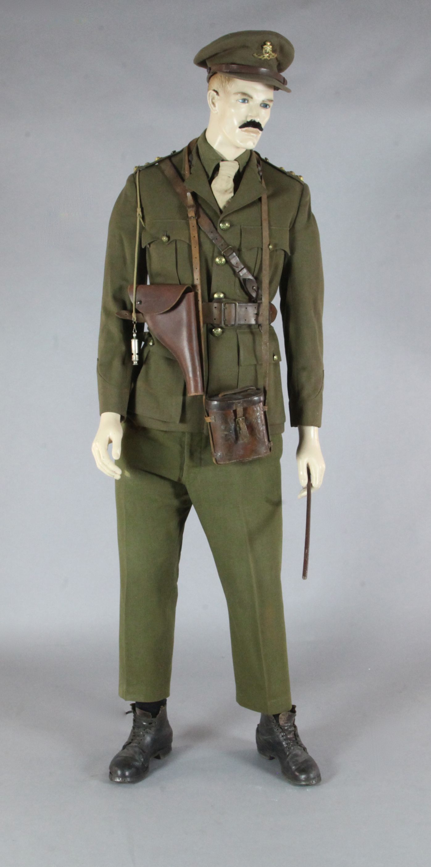A WWI Royal Field Artillery officer's dress uniform and accessories, on a mannequin, of the type