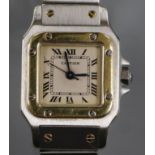 A lady's stainless steel and yellow metal Santos De Cartier automatic wrist watch, no box or