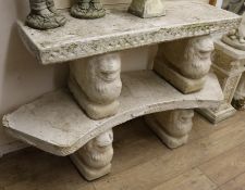 Two reconstituted stone garden benches, on lion supports W.119.5 and 140cm approx