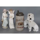 Two Nao figures and a pair of Staffordshire dogs and a beer stein