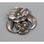 An early 20th century Danish Georg Jensen sterling silver stylised flowerhead brooch, no. 97,