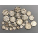 A group of UK silver and bronze coins George III to George VI including an 1844 crown, edge knocks