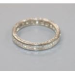 A white metal and square cut diamond full eternity ring, size I.