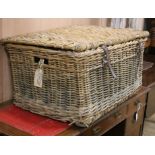 A wicker laundry basket W.85cm