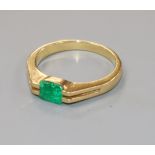 An 18k and solitaire emerald ring, size O/P.