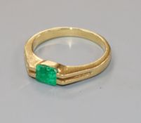 An 18k and solitaire emerald ring, size O/P.