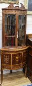 A 19th century Sheraton design marquetry inlaid mahogany bowfront corner display cabinet W.74cm