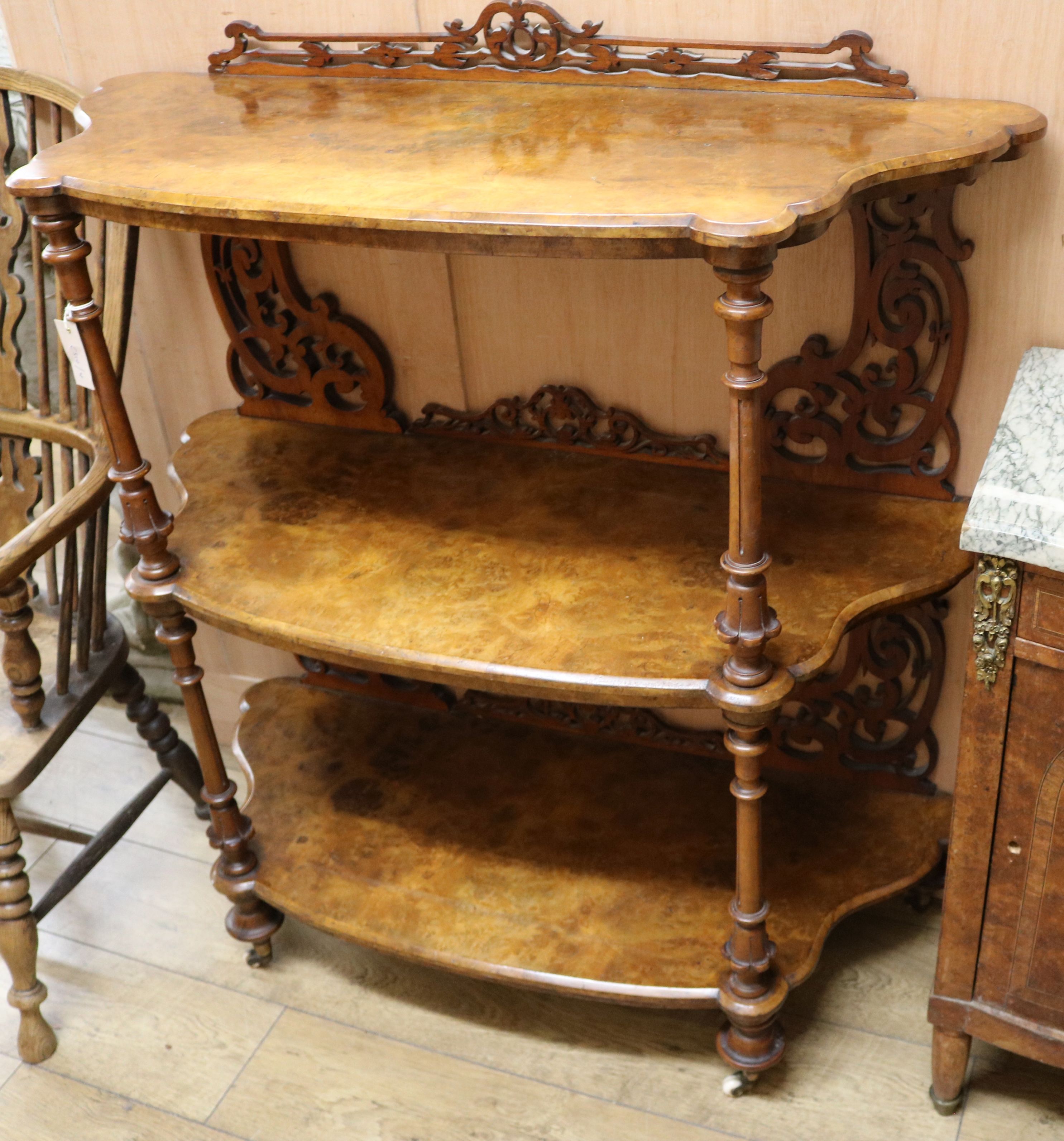 A Victorian walnut three tier whatnot W.107cm