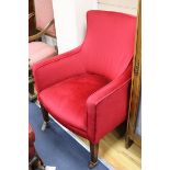 A pair of late 19th century/ early 20th century armchairs on fluted square legs