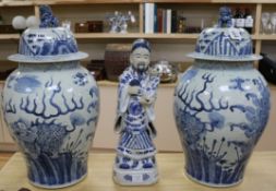 A pair of modern Chinese blue and white baluster vases and a blue and white figure of a sage holding