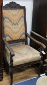 An 18th century French oak elbow chair