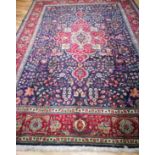 A Tabriz blue ground carpet 340 x 253cm