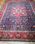 A Tabriz blue ground carpet 340 x 253cm