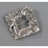 A Danish Georg Jensen sterling silver square recumbent deer brooch, no. 318, 38mm.