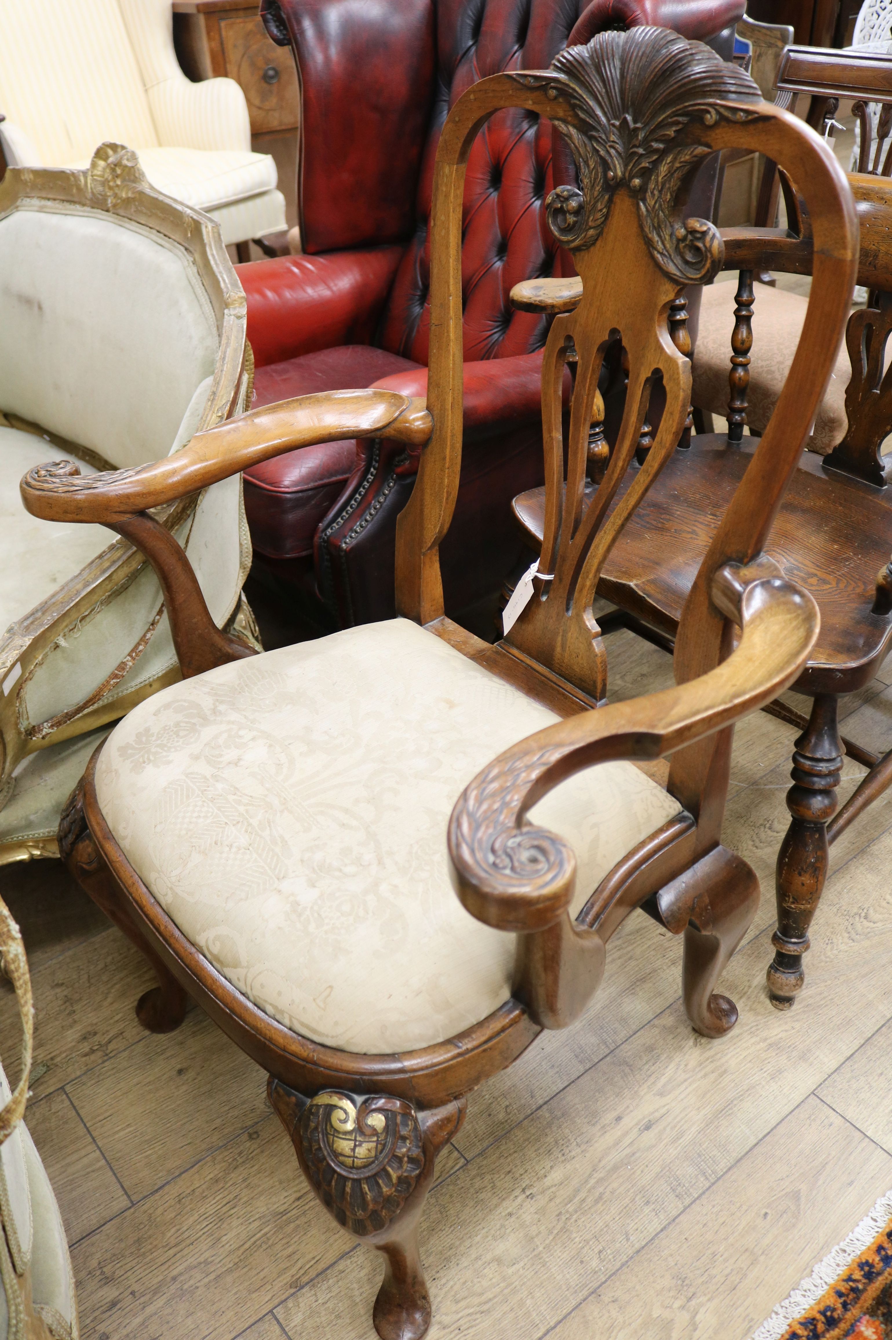 A George I style walnut and parcel gilt carver chair