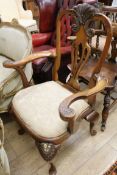 A George I style walnut and parcel gilt carver chair