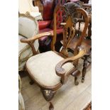 A George I style walnut and parcel gilt carver chair