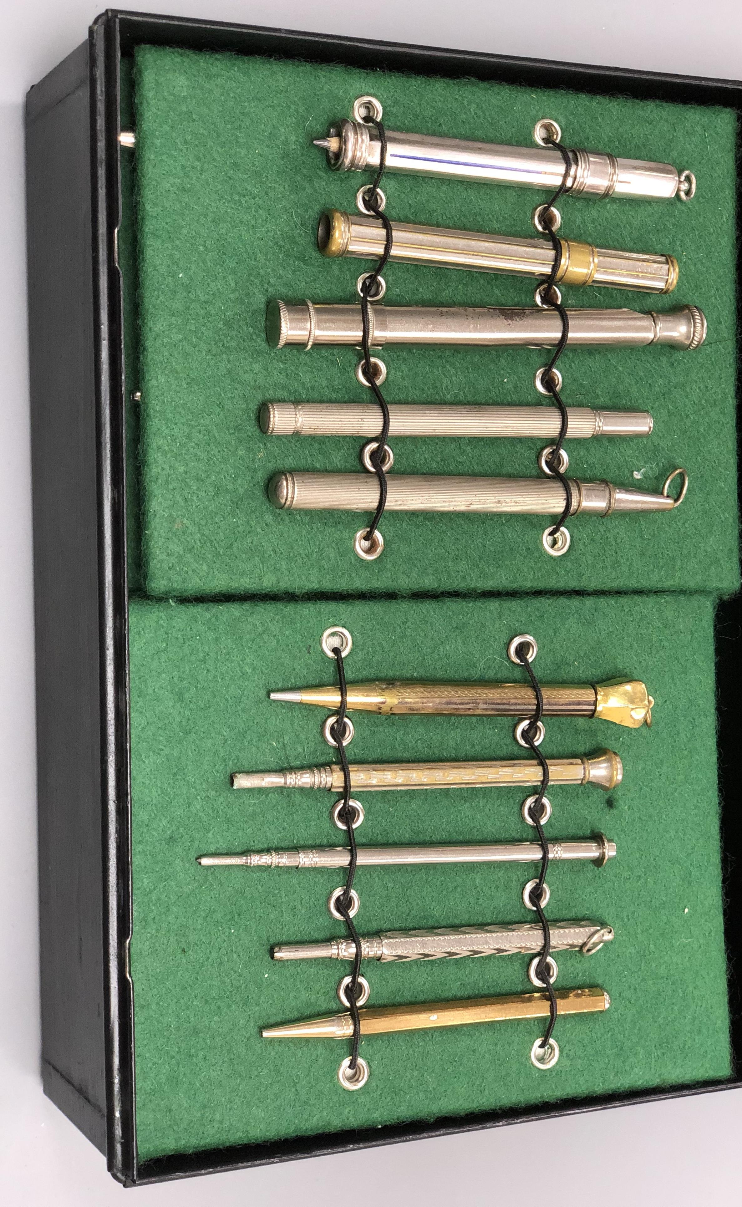 A collection of vintage propelling pencils in a tin case (57)