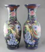 A pair of large Chinese blue ground 'dragon and phoenix' vases, 19th century, painted with dragons