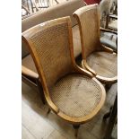 A pair of cane seated chairs