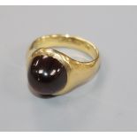A 1930's 18ct gold and cabochon garnet ring, size E.