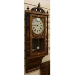 A late Victorian inlaid walnut eight day wall clock W.39cm