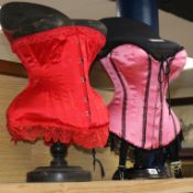 Two Victorian style corsets on stands