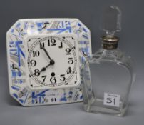 A German porcelain clock and a silver mounted decanter