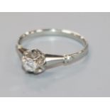 An 18ct white gold and claw set solitaire diamond ring, size N.