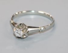 An 18ct white gold and claw set solitaire diamond ring, size N.