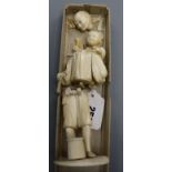 A Japanese ivory group of father carrying child