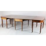 A Regency mahogany dining table, comprising central drop leaf and two D shaped ends, on turned