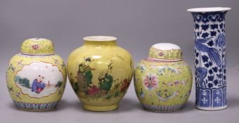 A Chinese enamelled biscuit vase, a blue and white sleeve vase and a pair of jars and covers