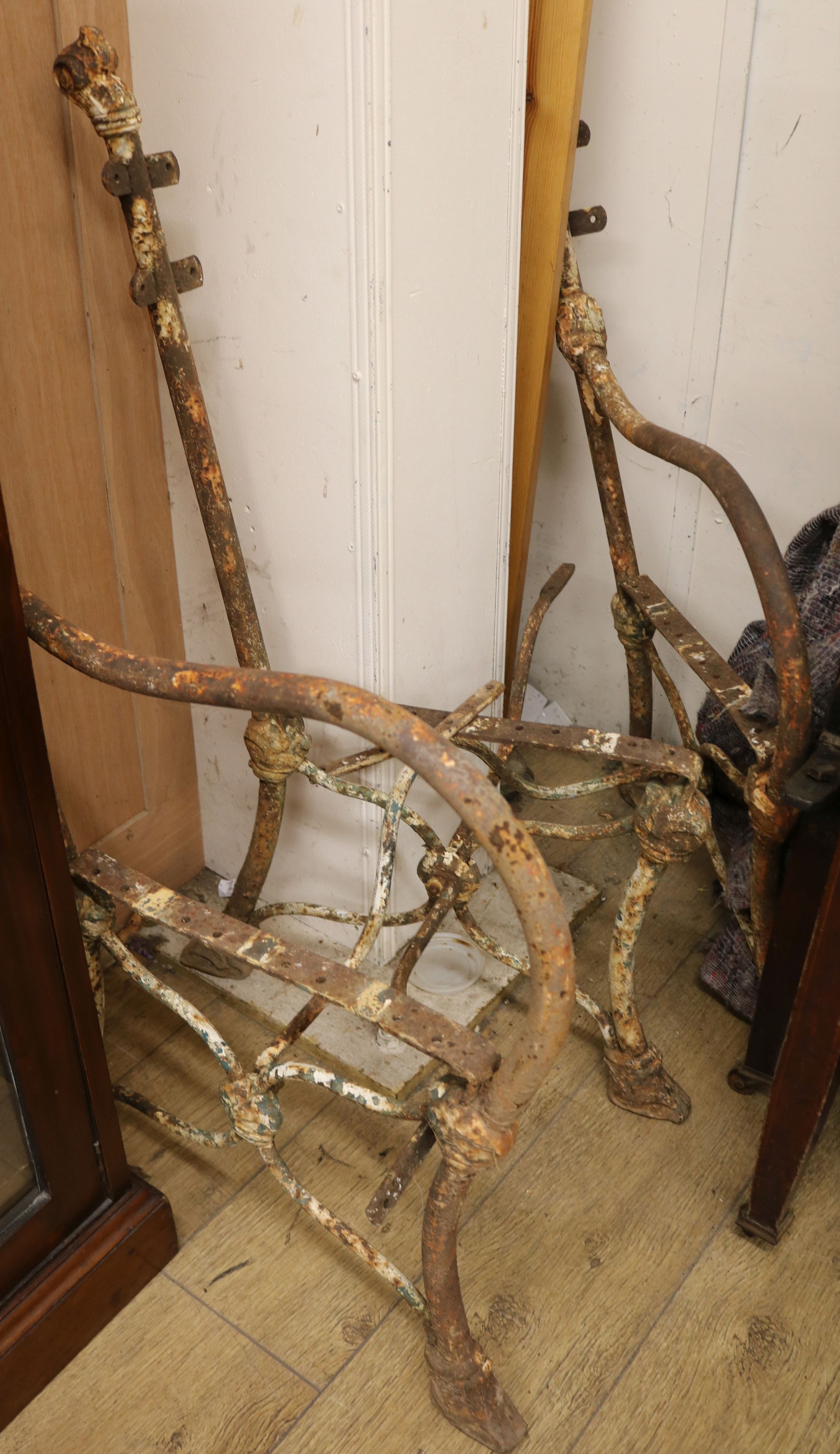 A cast iron triple garden bench frame W.56cm approx.