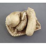 A Japanese ivory netsuke of vegetables on a woven tray, Meiji period, signed Komei, l. 3.7cm