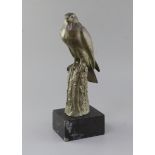 Irénée Rochard (1906-1984). A green patinated bronze model of a falcon perched upon a tree stump,